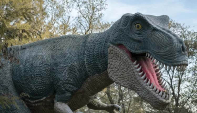 Model of a dinosaur in park